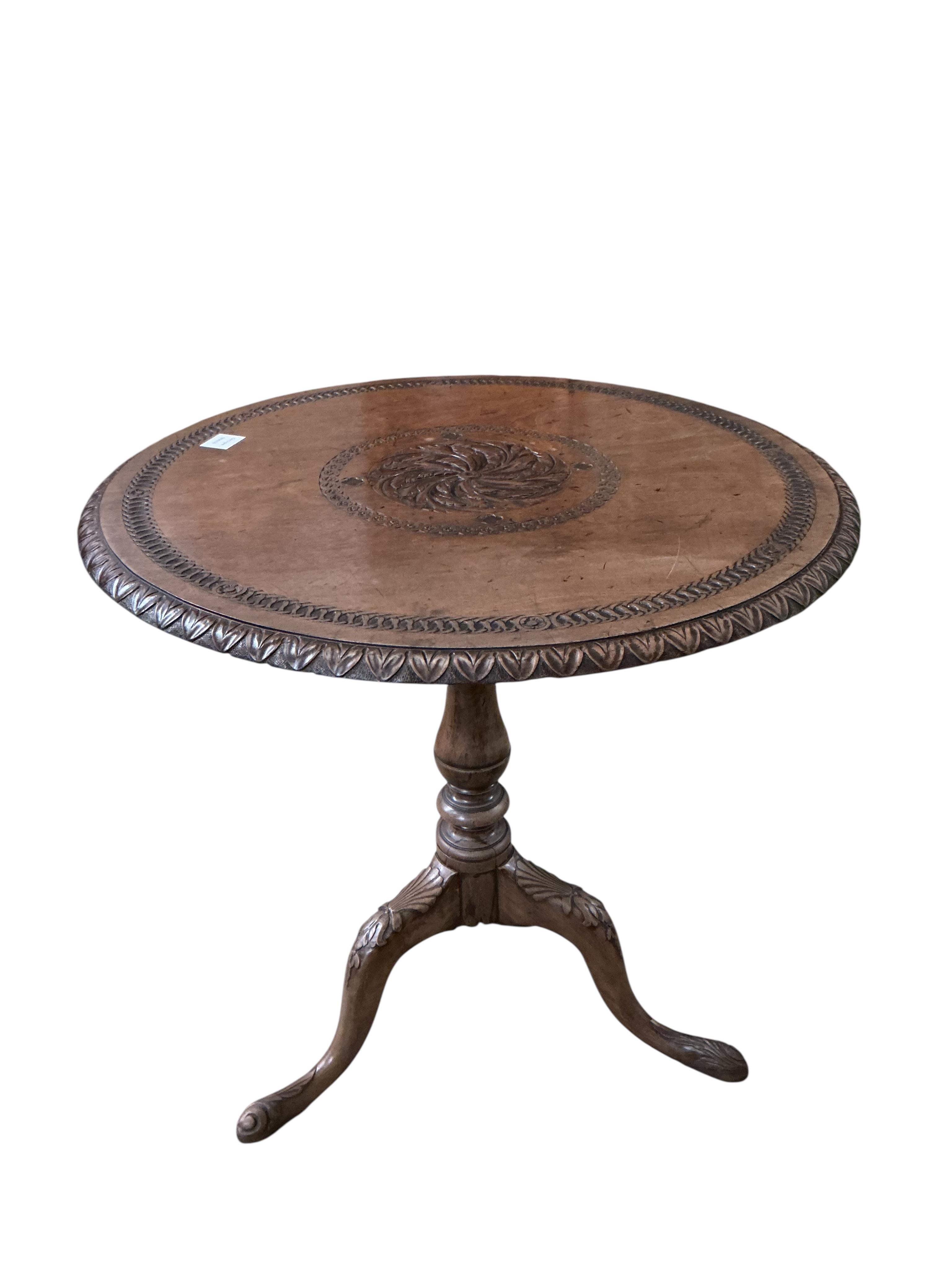 A George III and later mahogany circular tripod tea table, the carving later, diameter 73cm, height 73cm